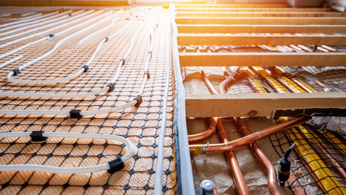 Wet vs electric underfloor heating – are you making a huge mistake fitting one over the other? This is what the heating pros say