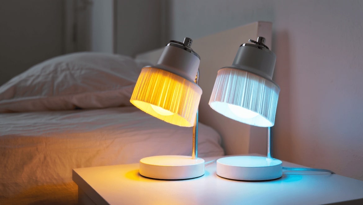 Black and iron scalloped table lamp on a girl's bedroom nightstand