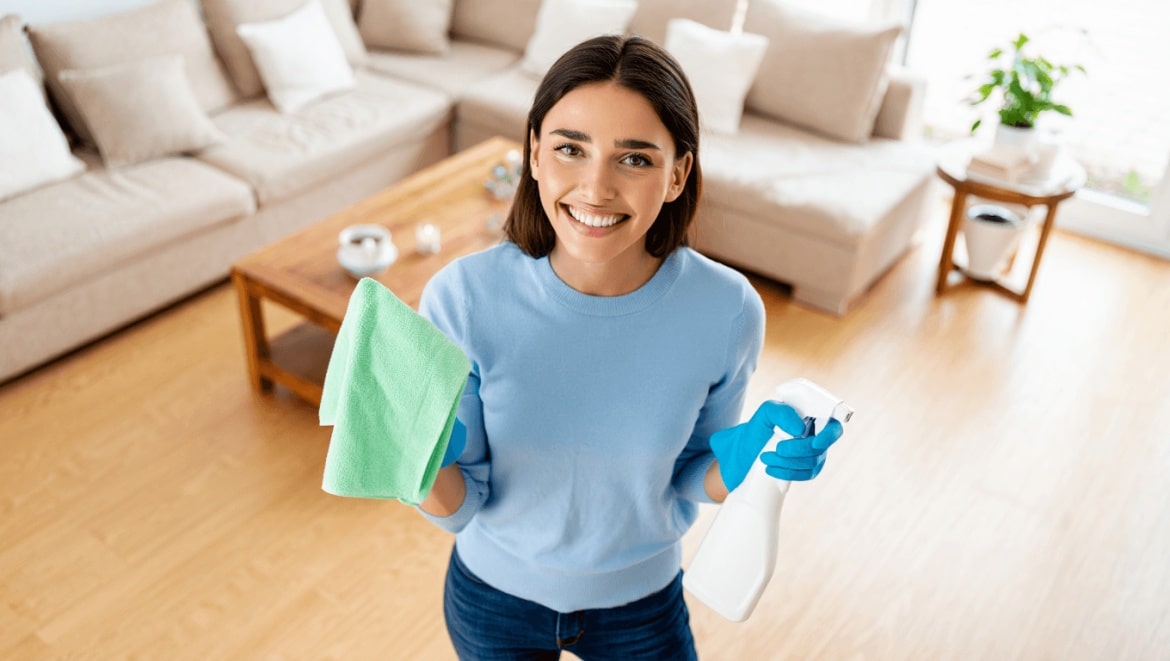Julia pushing a steam mop in her laundry room