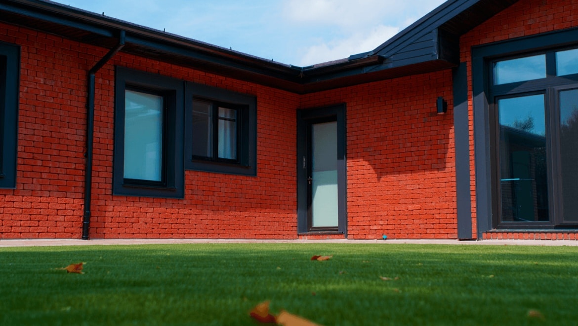 Modern Colonial Brick Home Backyard Exterior with Cromwell Gray Paint Trim and Pool 